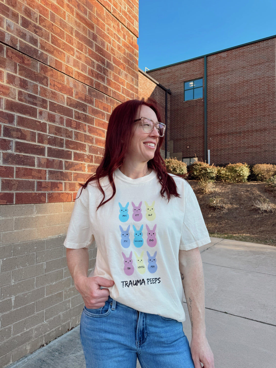 Ladyspinedoc wearing  Trauma Squad Tee – Beige Short Sleeve with Pastel Bunnies and Trauma Lingo
