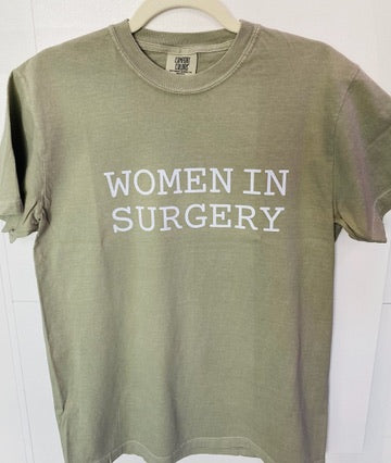 Green t-shirt with 'WOMEN IN SURGERY' text on a white background
