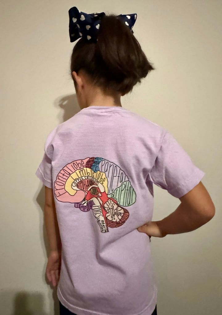 Girl showing off the back of the purple "I Lobe You" Brain Anatomy Tee with labeled parts of the brain