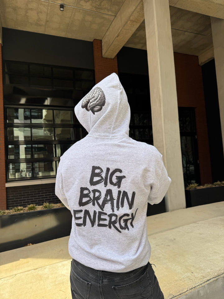 Dr. Betsy Grunch - Ladyspinedoc wearing the BIG BRAIN ENERGY light gray hoodie with the hood up, showcasing the brain design on the left side of the hood.
