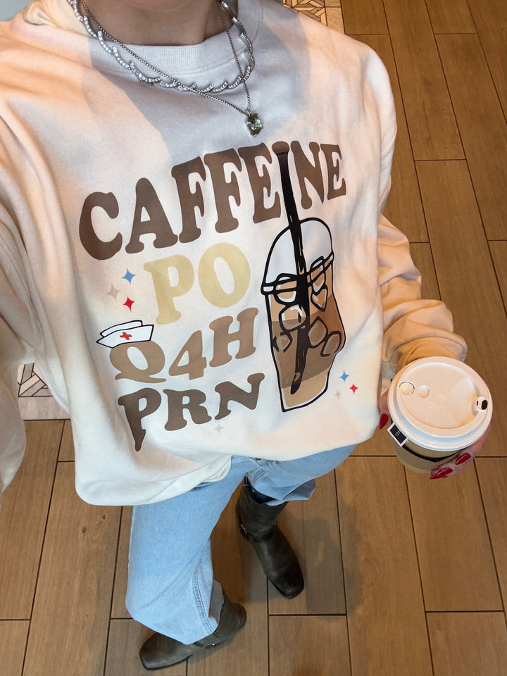 Close up view of front design of the Perk Up Rx Crewneck Sweatshirt showing design details.

