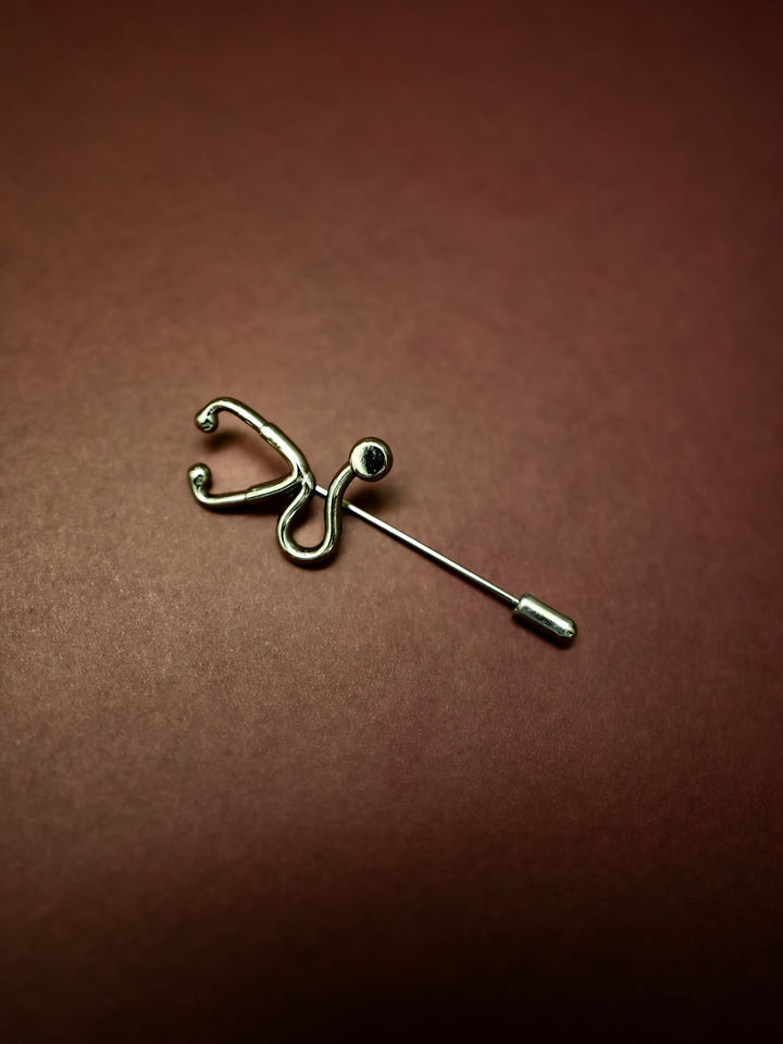 Silver Stethoscope Jacket Lapel Pin on burgundy background