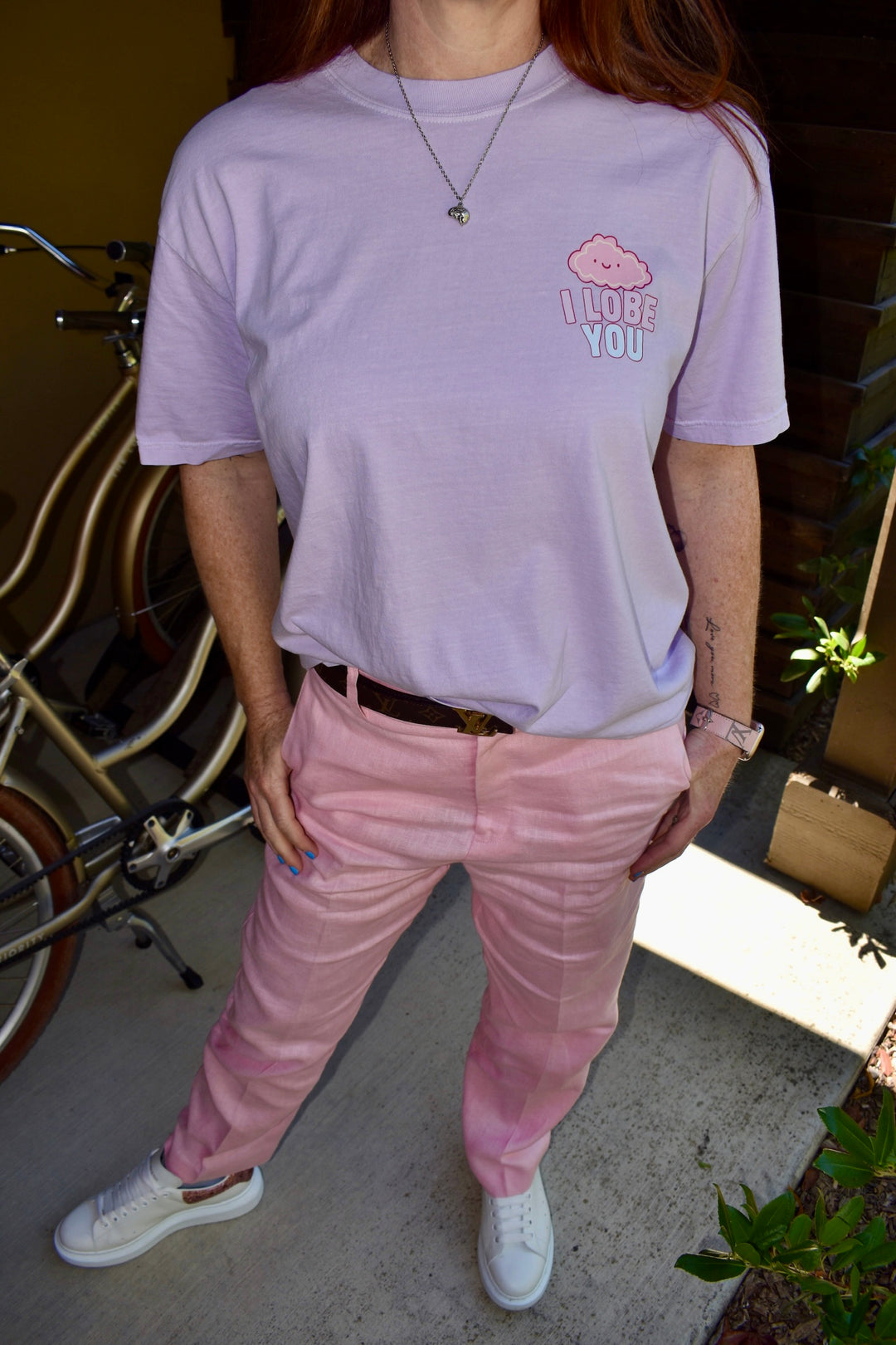 Ladyspinedoc showing off the front design on the I Lobe You Brain Anatomy Tee.