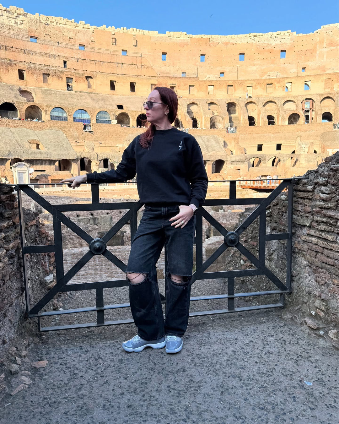 Ladyspinedoc (Dr. Betsy Grunch) at The Colosseum in Rome Italy wearing the Incredible Sweatshirt showing her lightning bolt logo on the upper left chest. 