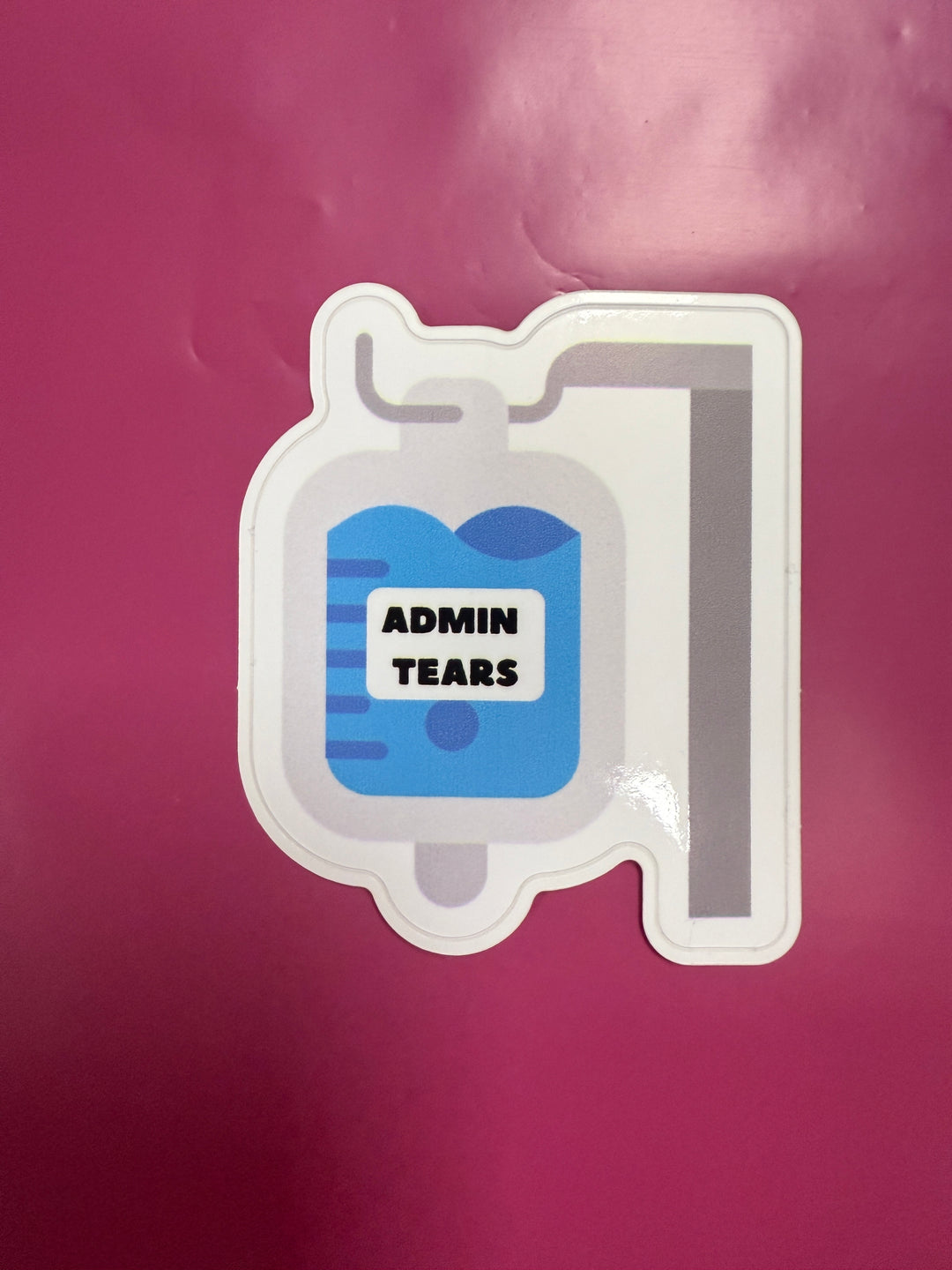 Sticker with 'ADMIN TEARS' design on a purple background