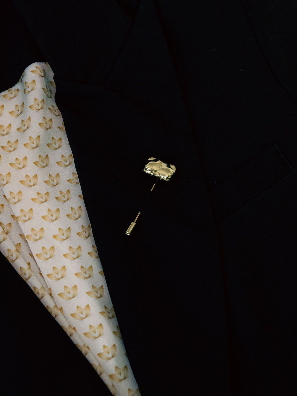 Gold Candace Bust / Breast / Bosom Stick Pin shown on a black jacket lapel