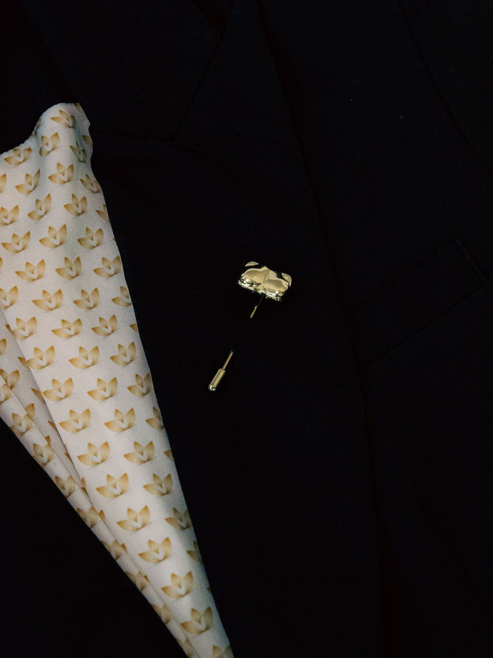 Gold Candace Bust / Breast / Bosom Stick Pin shown on a black jacket lapel