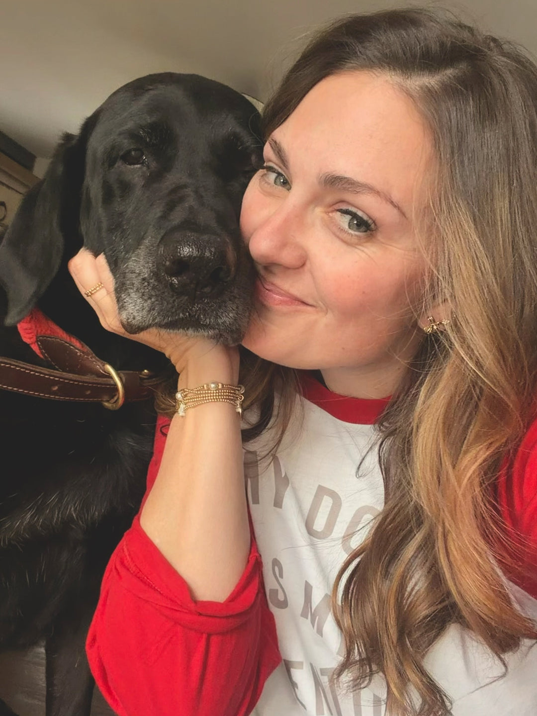 Dr Molly with a black dog, both looking at the camera