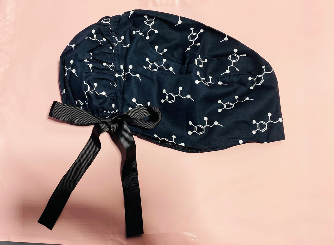 Code Cart Cap - Black Scrub Hat with White Adrenaline Design on a light pink background