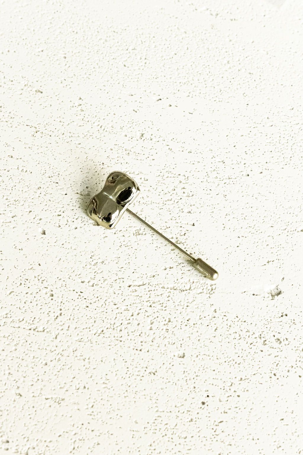 Silver Bust / Breast / Bosom Stick Pin on white background