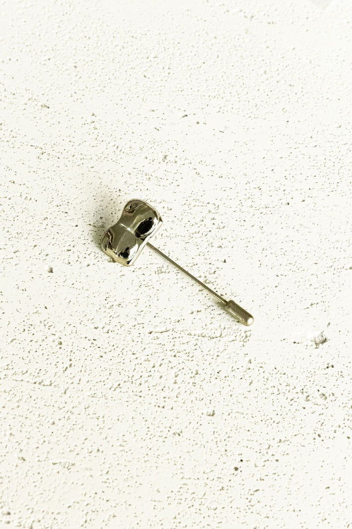 Silver Bust / Breast / Bosom Stick Pin on white background