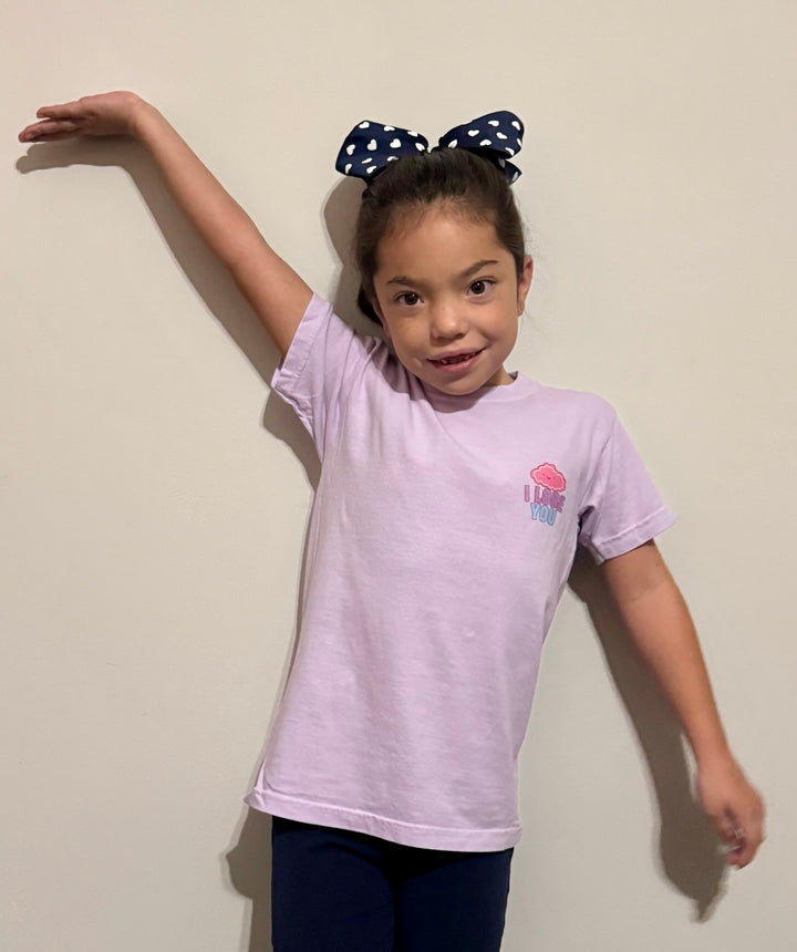 Girl with hairbow showing off the front of the "I Lobe You" Brain Anatomy Tee 