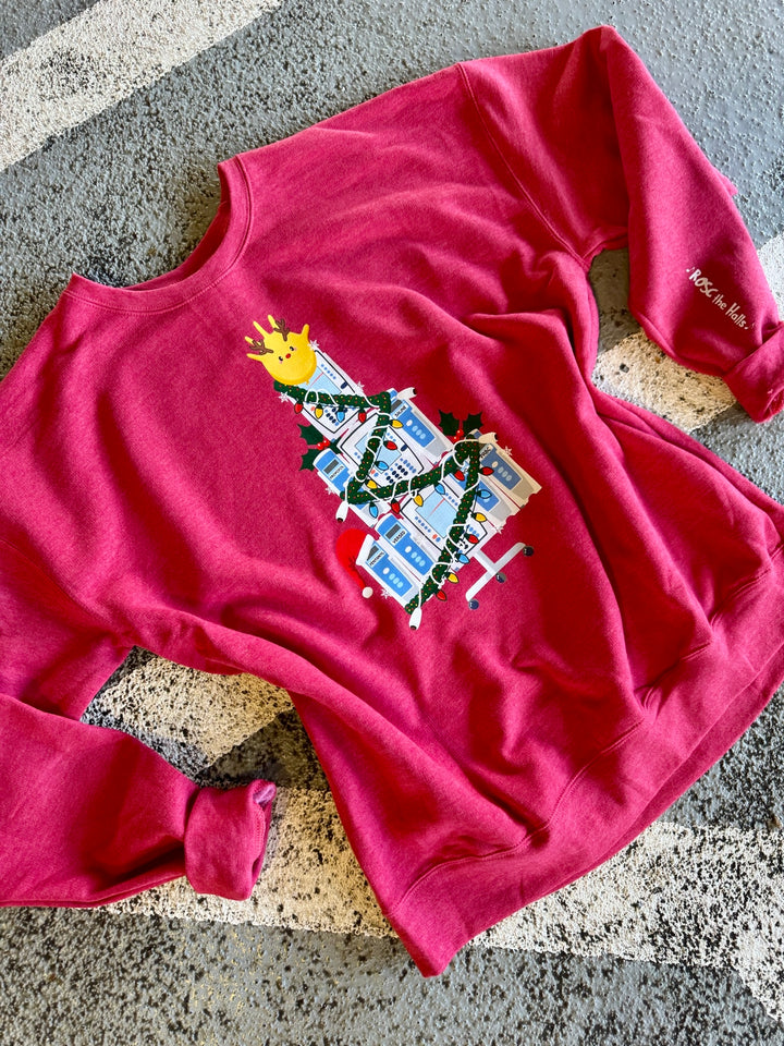 Red ROSC the Halls | IV Pump Christmas Tree sweatshirt on a textured surface