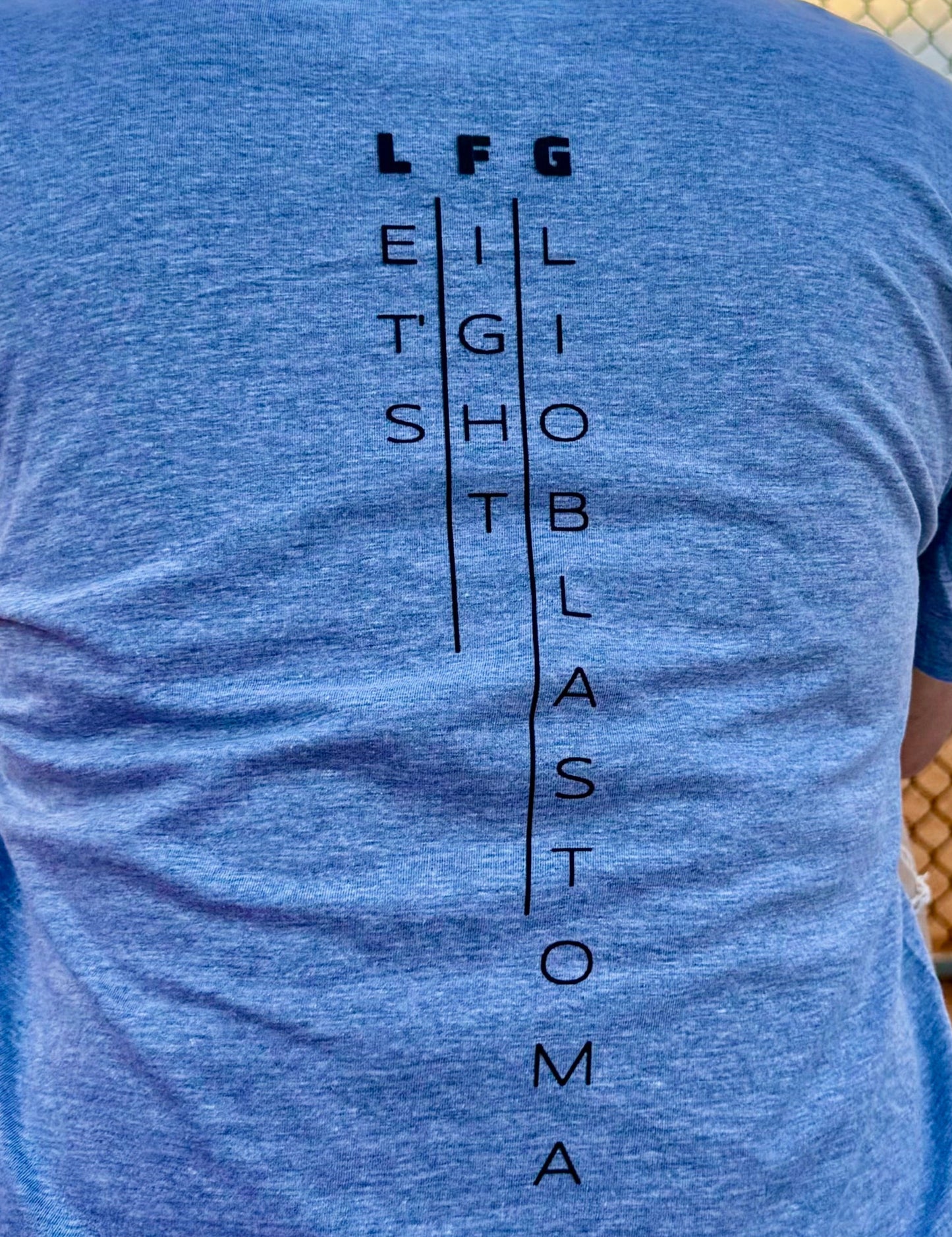 Close up of LFG - Let's Fight Glioblastoma design on back of Brain Tumor Awareness Tee