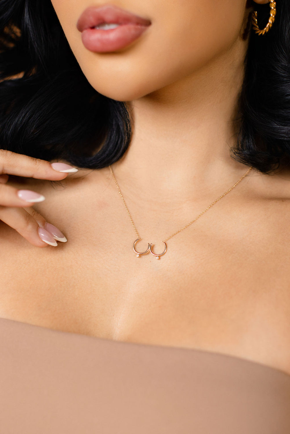 Model wearing gold Bust Necklace with Diamond Nipples