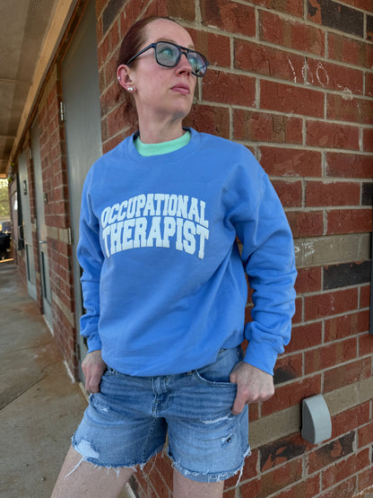 Dr. Betsy Grunch (Ladyspinedoc) modeling her blue Occupational Therapist sweatshirt. 