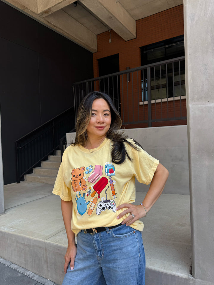 Model wearing yellow Ladyspinedoc x Scrubhacks Pediatrics Collage Tee Shirt 