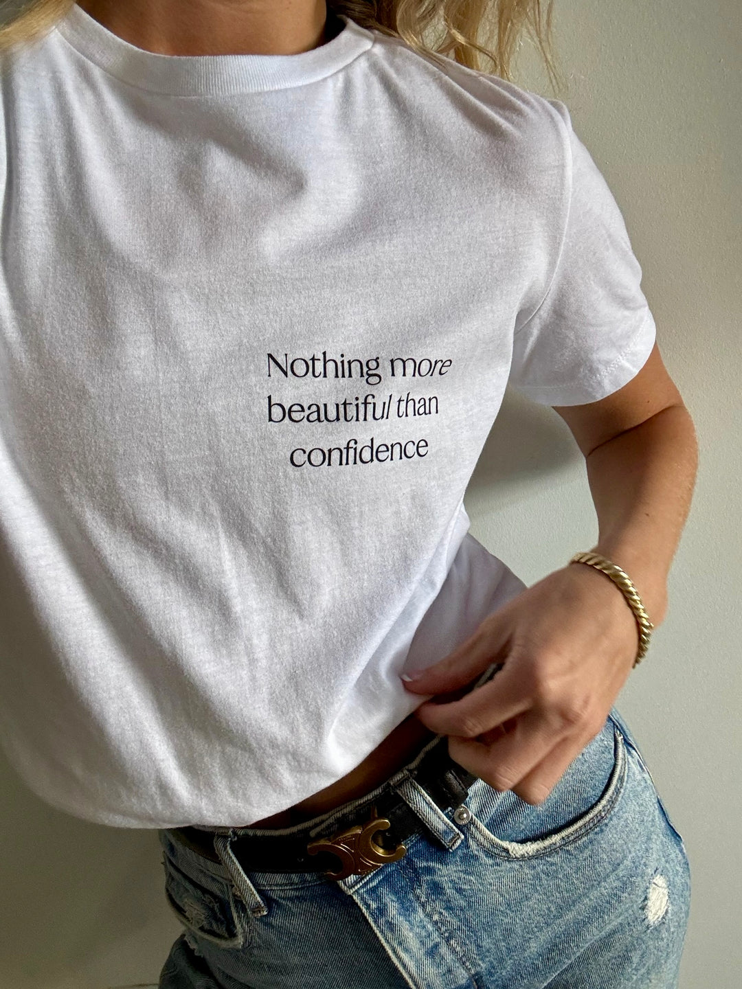 Model wearing The Confidence Doc Confidence Tee Shirt that says "Nothing more beautiful than confidence"