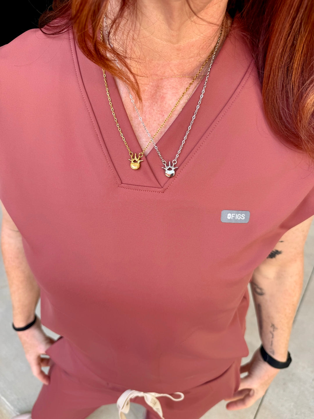 Ladyspinedoc wearing the Lumbar Spine Vertebra Necklaces in Silver and Gold