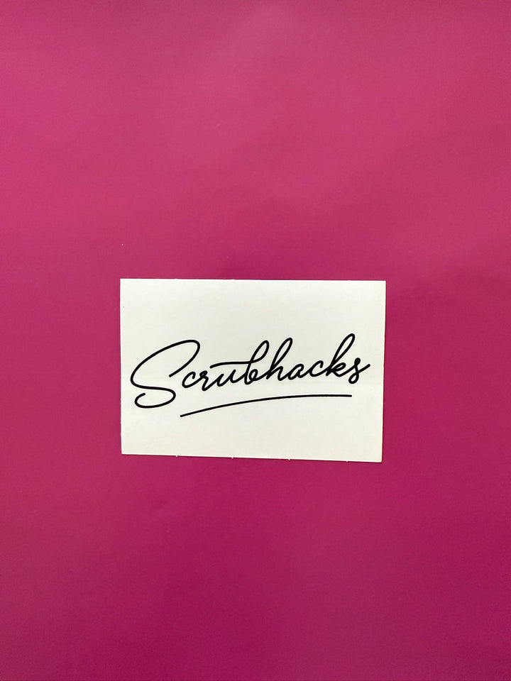 White sticker with 'Scrubhacks' text on a pink background