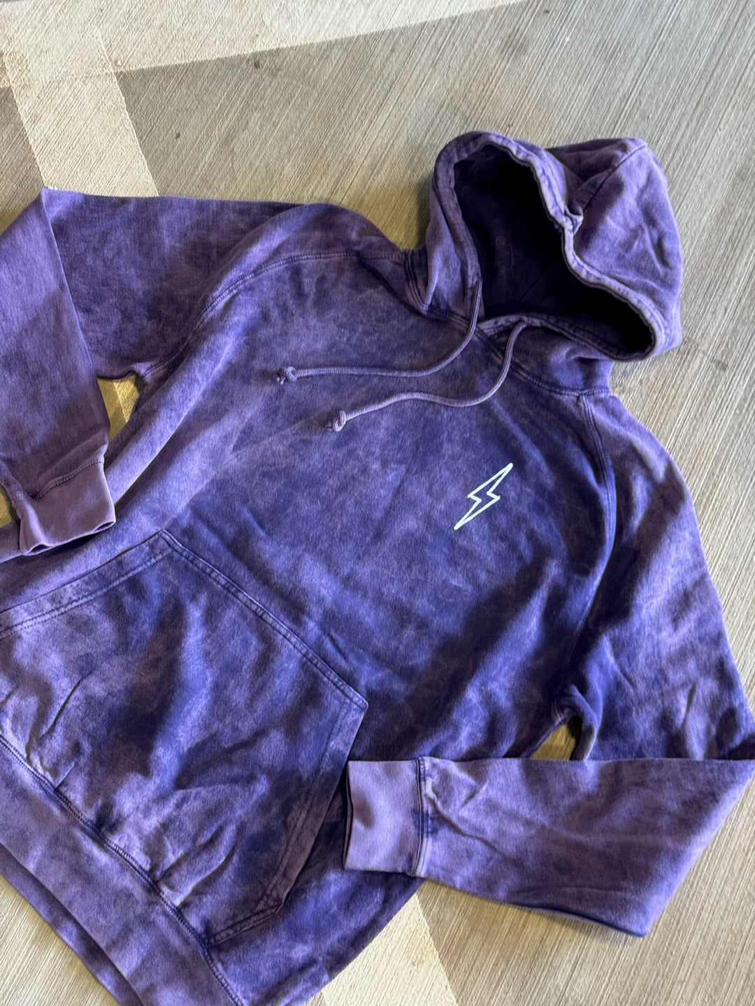 Flat lay of the front of the purple Incredible Hoodie