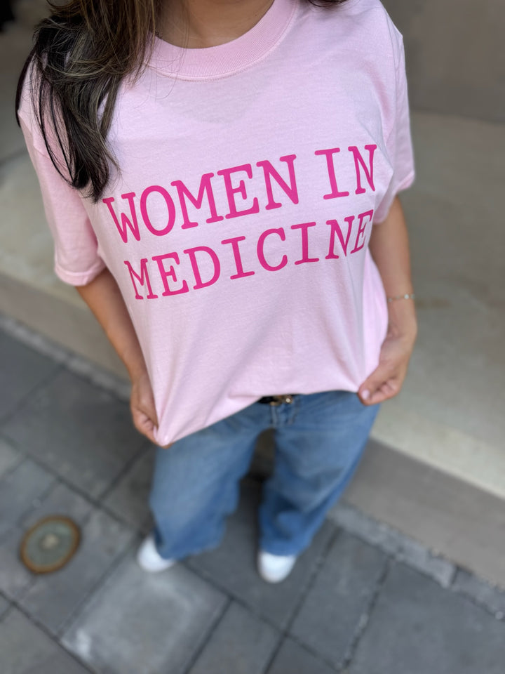 Close up of model wearing pink Women in Medicine Tee Shirt - Empowering Short Sleeve T-Shirt for Healthcare Pros
