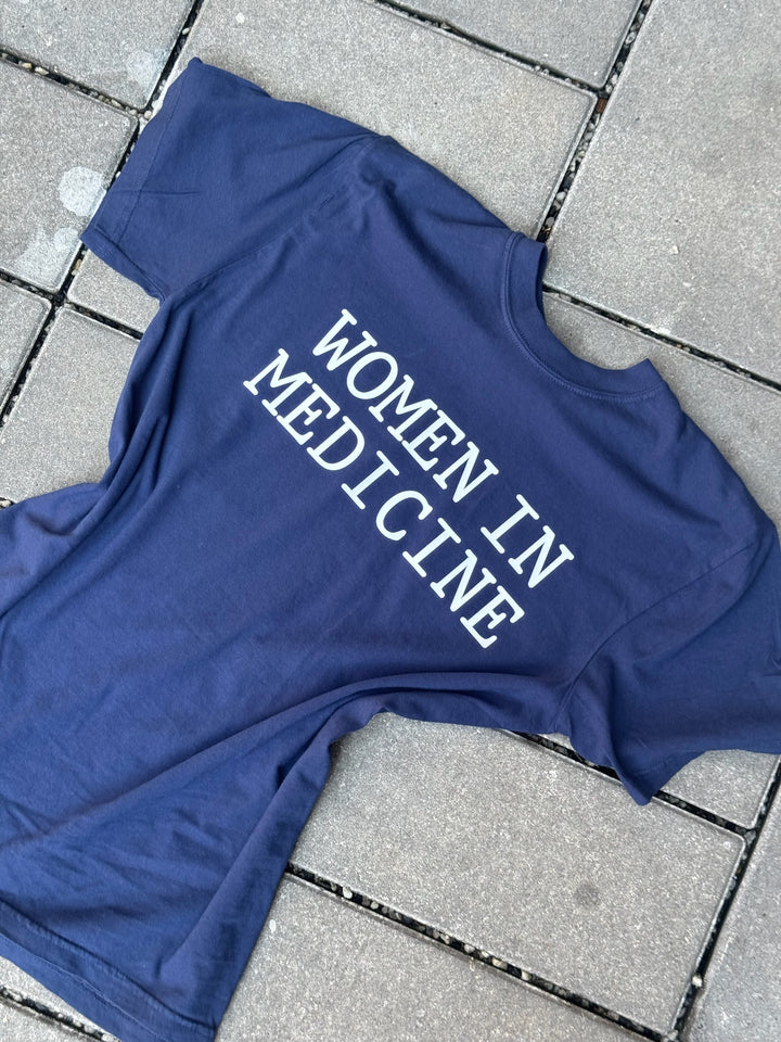 Flat lay of navy Women in Medicine Tee Shirt - Empowering Short Sleeve T-Shirt for Healthcare Pros