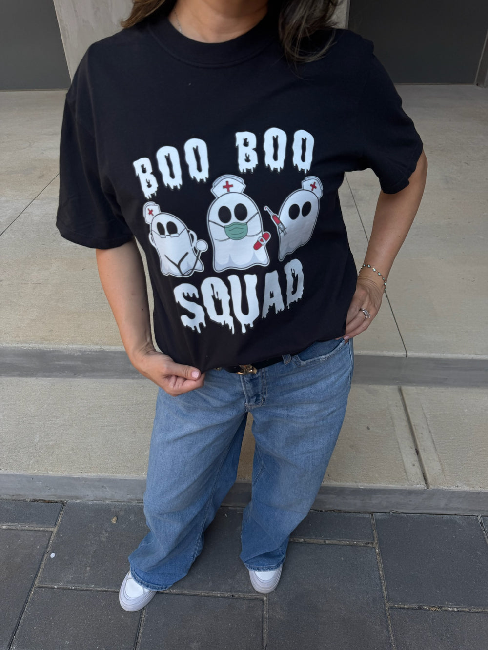 Model wearing Ladyspinedoc x Dr. Beachgem Collab: Boo Boo Squad Tee Shirt – Halloween Shirt for Healthcare Heroes with ghost nurses
