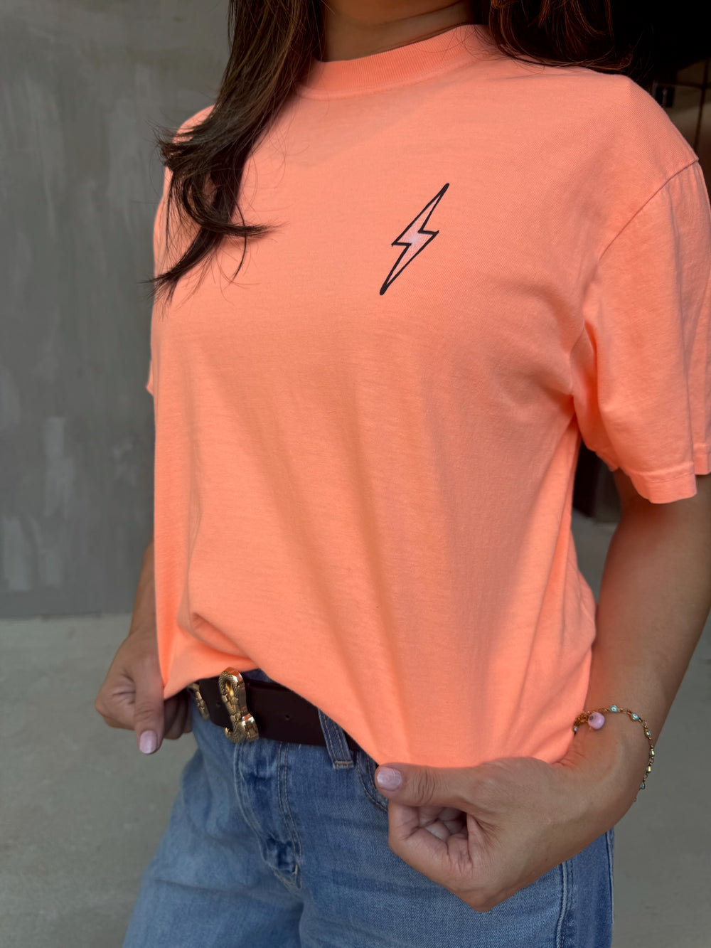 Model showing front of Halloween Spooky Spine - Orange Short Sleeve Tee Shirt