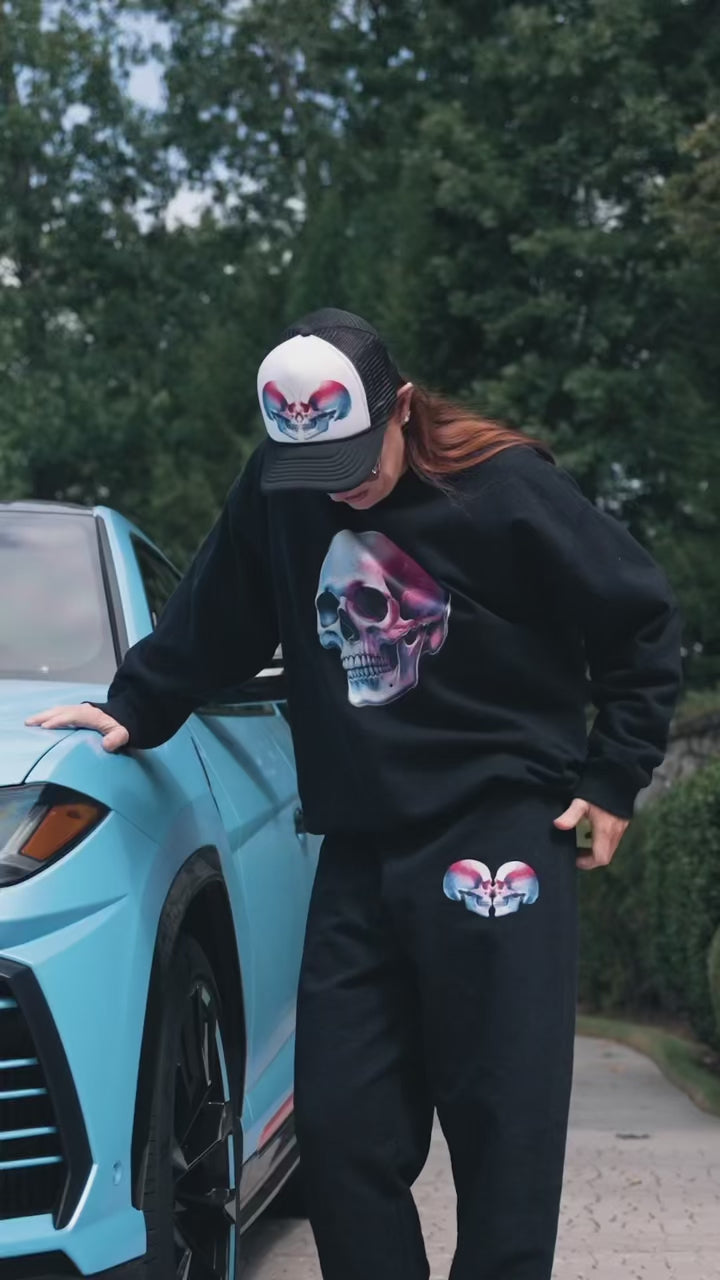 Load video: hype video for clothing launch featuring neurosurgeon wake suffering and with her luxury vehicles